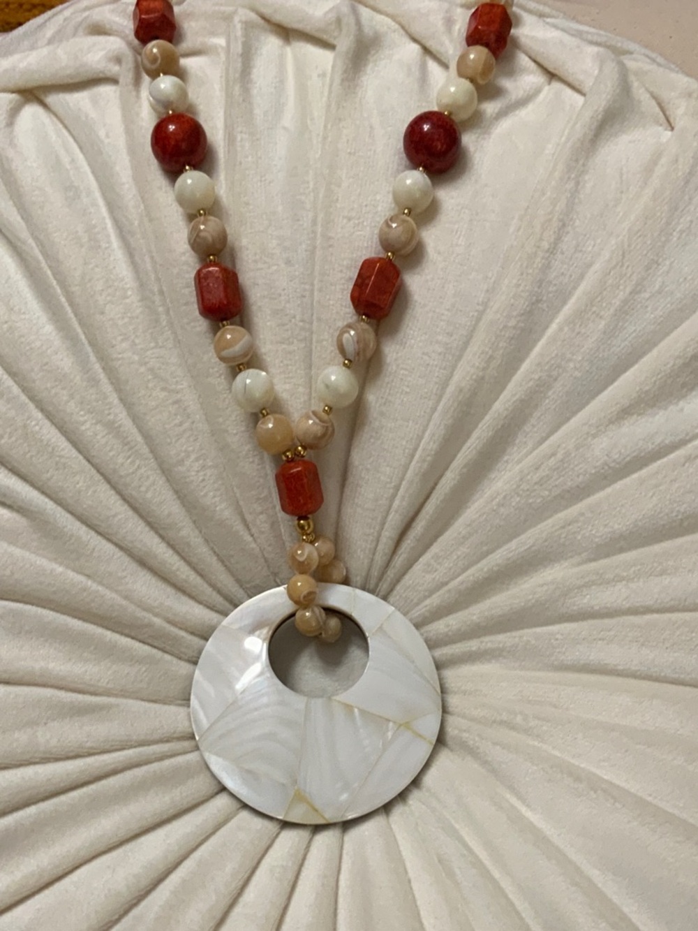 White Disc Pendant Necklace with Red and Cream Beads